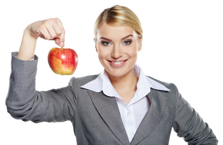 女商人与红苹果在她的手健康饮食概念