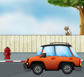 一辆车在公路和一只猫上方的围栏