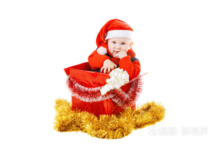 婴儿与在圣诞节框中的礼物