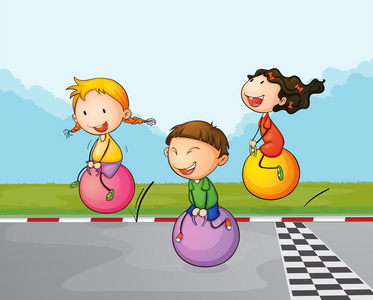 街球艺术三个孩子与他们的弹跳球一条街照片