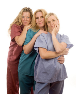 三个护士在医疗磨砂的衣服图片