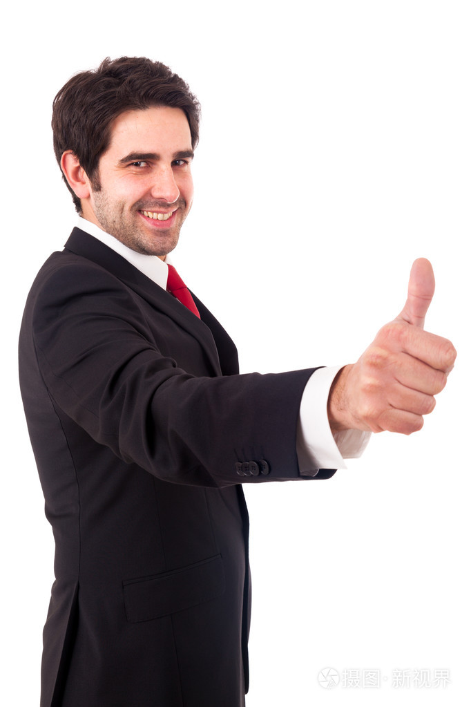 快乐的微笑着的年轻商业人的姿态竖起大拇指与隔离