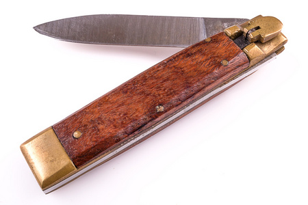 白上孤立的木柄口袋刀照片