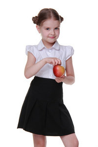 一个美丽的女学生举行一个苹果的肖像