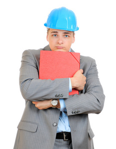 工程师与蓝色安全帽持有孤立在白色背景上的文件夹