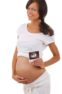 孕妇与超声的婴儿照片的肖像图片