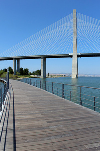 Parque das Naes footpath and famous Vasco da Gama bridge. Lisb