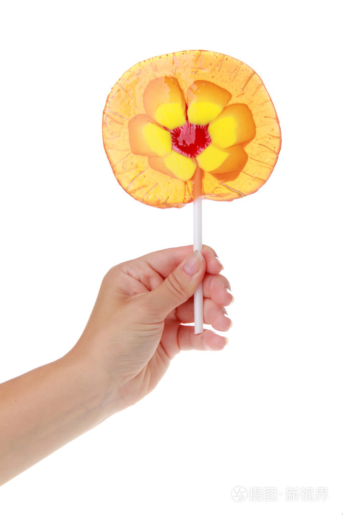 只手握住一根棒棒糖上白色隔离