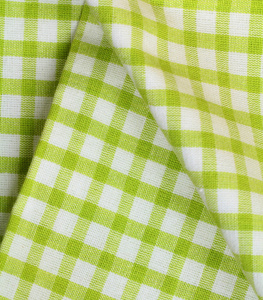 在绿色厨房巾方格的使用作为背景