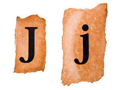 老纸上的标头大写字母和小写字母 j照片