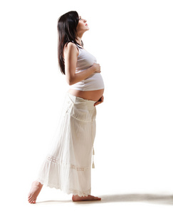 快乐年轻怀孕妇女在白色