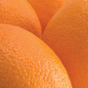 橙色的桔子水果皮纹理宏特写,详细的工作室拍摄的纹理的图案背景照片