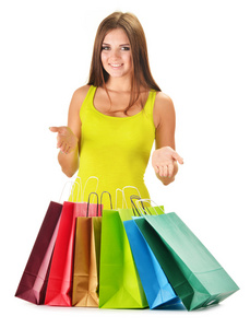 彩色的纸购物袋隔离年轻的幸福女人