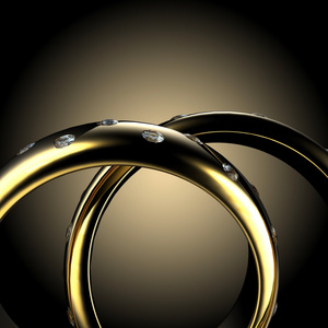 黄金与钻石的订婚戒指。假日符号