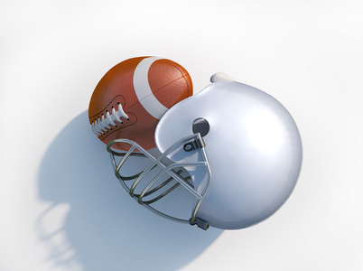 美式橄榄球头盔与孤立的球