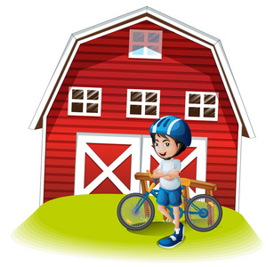 一个男孩与一个自行车站在农舍前