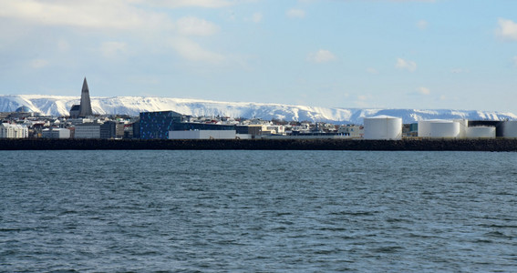 View of the city of Reykjavk ships sailing on the sea