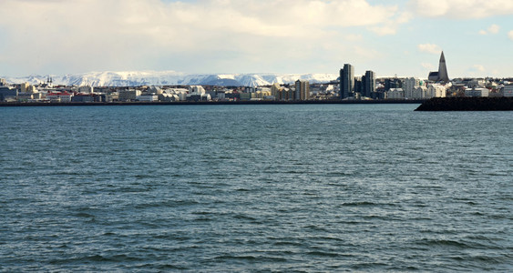 View of the city of Reykjavk ships sailing on the sea