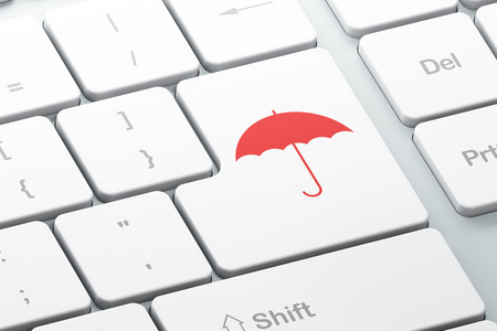 安全概念 计算机键盘背景上的雨伞