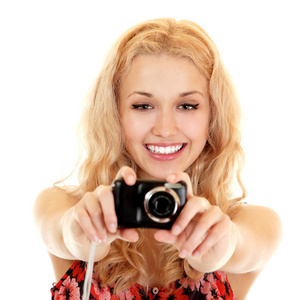 幸福的年轻女人摄影师做照片的照相机