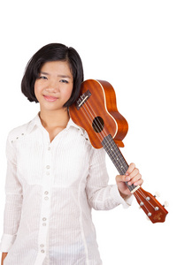 年轻的亚洲女孩，抱着四弦琴