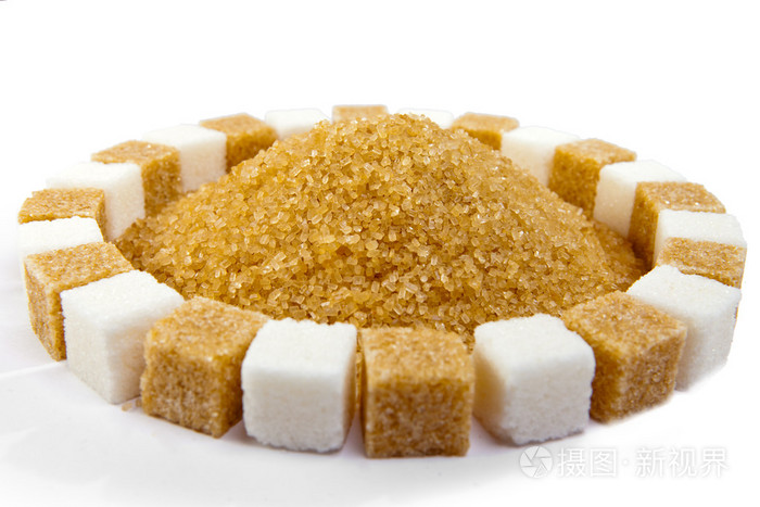 方糖躺在圈子和砂糖里面一堆上立着棍子糖果糖