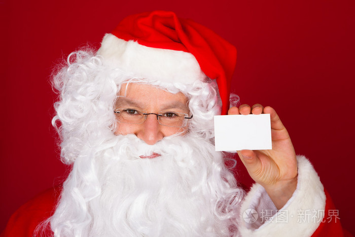 持有空白名片是圣诞老人的画像