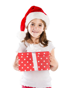 与圣诞礼物圣诞老人的帽子的小女孩
