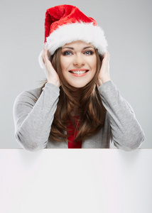 在圣诞老人的帽子，与空白横幅中的女人
