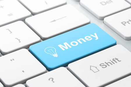 财务理念 灯泡和金钱上的计算机键盘背景