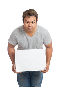 亚洲人举着空白的牌子低头照片