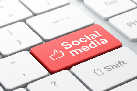 社会网络的概念 拇指向上和社交媒体上的计算机键盘背景