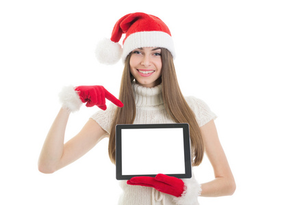 十几岁的女孩与圣诞老人帽子显示 tablet 计算机屏幕