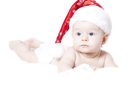 圣诞老人的帽子上白色孤立的新生儿的肖像