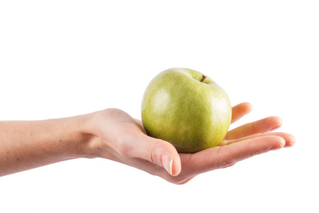 手中握有一个绿色的苹果