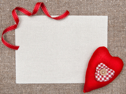 情人节卡与纺织的心和丝带