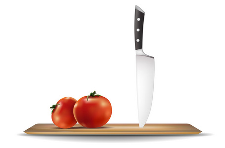 西红柿和在厨房切菜板上的刀图片