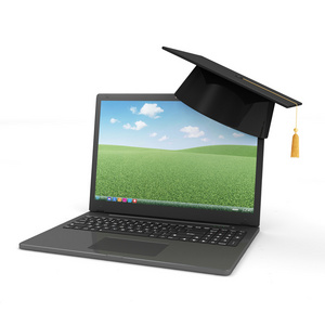 现代笔记本电脑与毕业帽图片