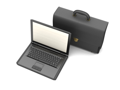 黑色皮革公文包和笔记本电脑