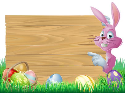 粉红色的复活节彩蛋签署复活节兔子