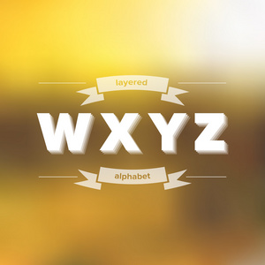 w x y z 平面分层字母表上模糊的背景