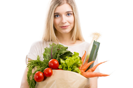 女人携带的包的蔬菜