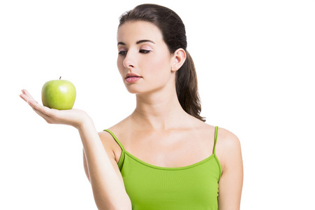健康的女人与一个绿色的苹果