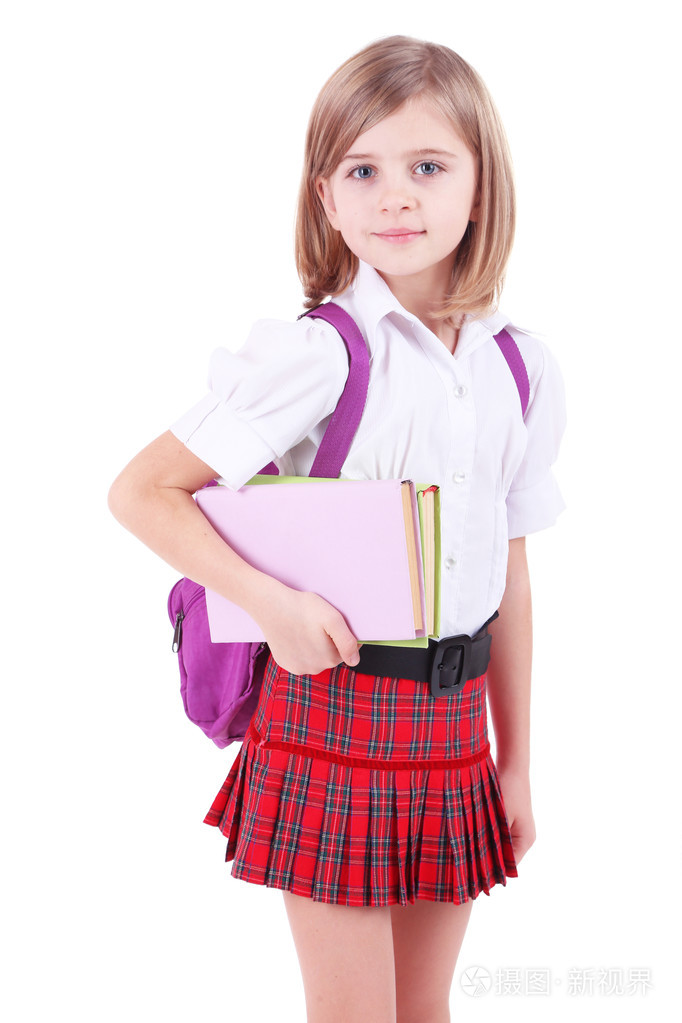 漂亮的小女孩,拿着书上白色孤立,背包里