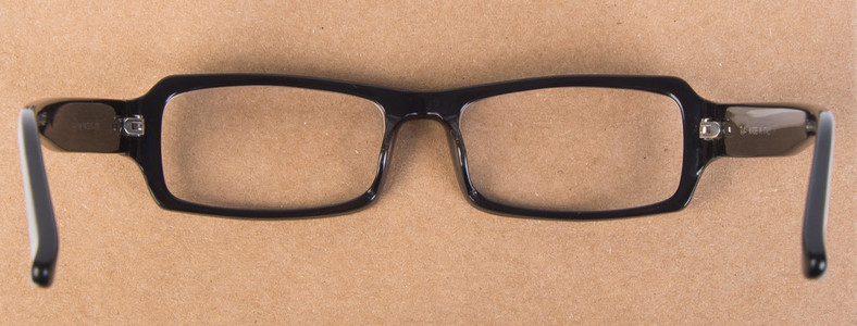 眼镜。眼镜与书背景