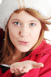 圣诞节的青少年女孩，在圣诞老人的帽子