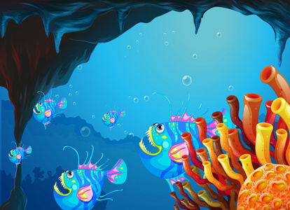 与一群鱼儿在深海之下的洞穴图片