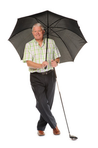 快乐休闲成熟高尔夫球用的伞图片