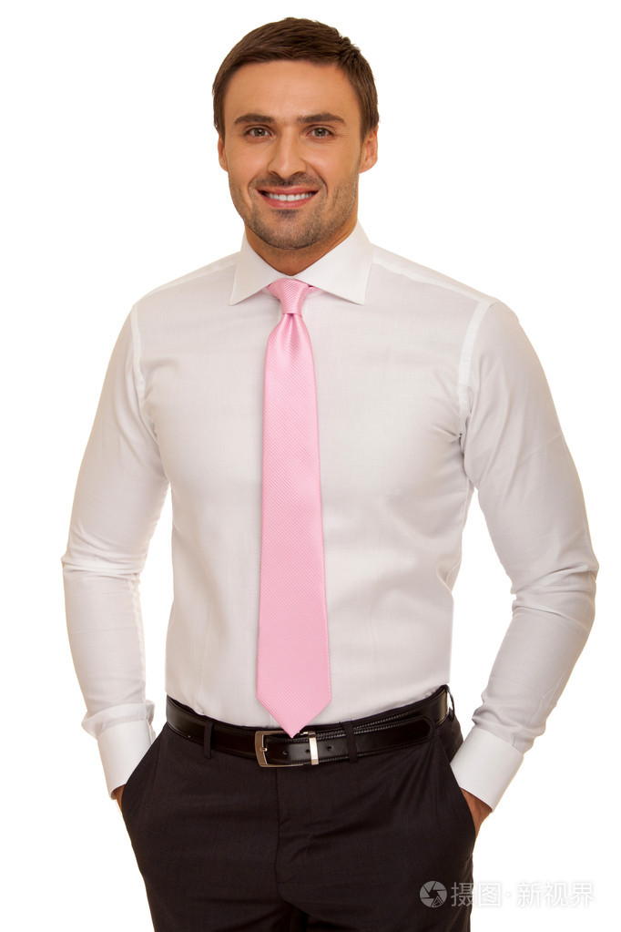 穿着整齐的西装,打领带.站在白色背景上的超凡魅力商人