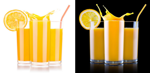 新鲜的橙汁在玻璃时溅起水花